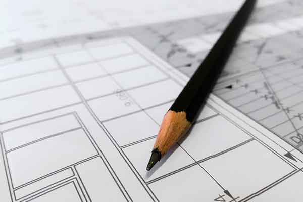 a pencil on a blueprint